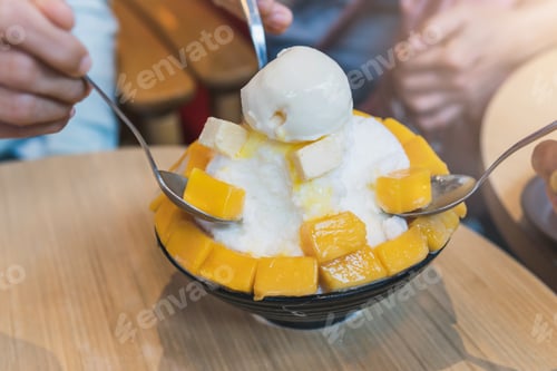 Preview: Group of people enjoy eating mango bing su, Korean dessert