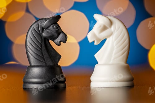 Preview: Two horse chess pieces in black and white