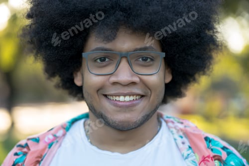 Preview: Portrait of young latin man outdoors.