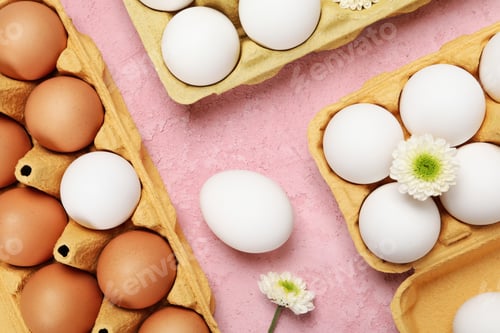 Preview: Concept of spring, eggs with flowers, top view