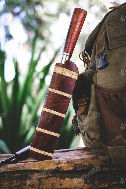 Preview: Enep Thai Knife and backpack for survival in the forest on an old timber wooden