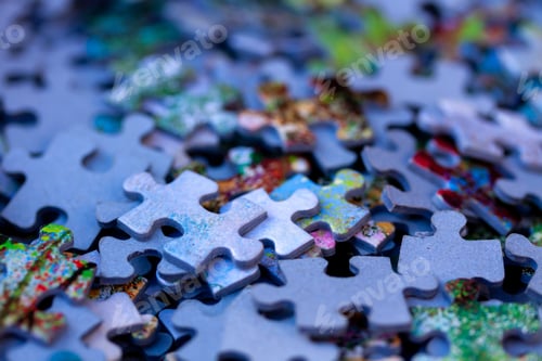 Preview: Selective focus shot of a pile of colorful puzzle pieces