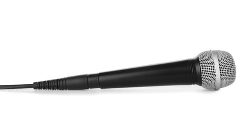 Preview: Microphone with wire on white background. Professional audio equipment