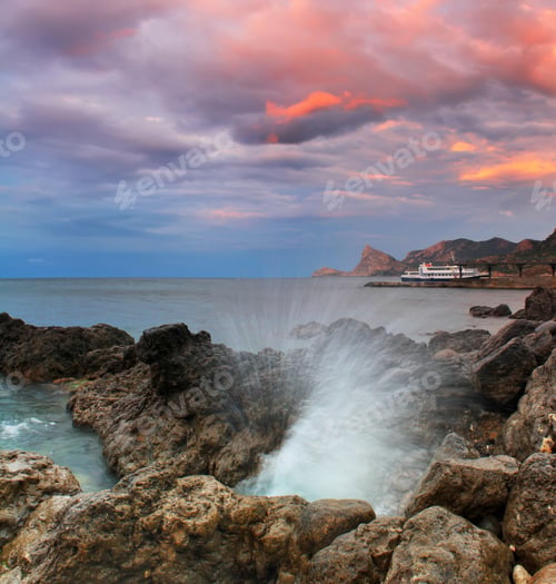 Preview: Ocean waves crash against a rock