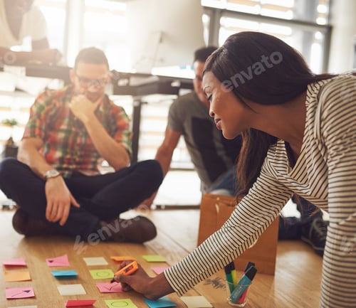 Preview: Woman writing on notes for workers on floor