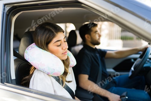 Preview: Exhausted woman taking a nap in the car