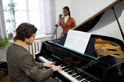 Preview: Pianist playing the piano in the classroom