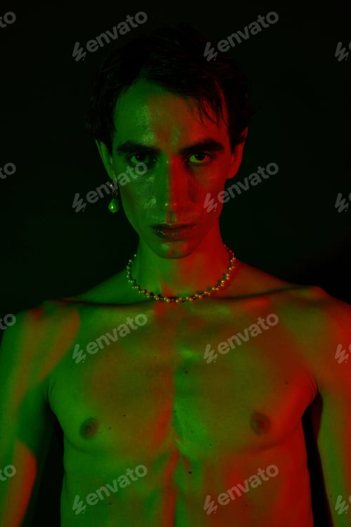 Preview: Stylish man exuding confidence with striking colors and bold fashion choices in vibrant lighting