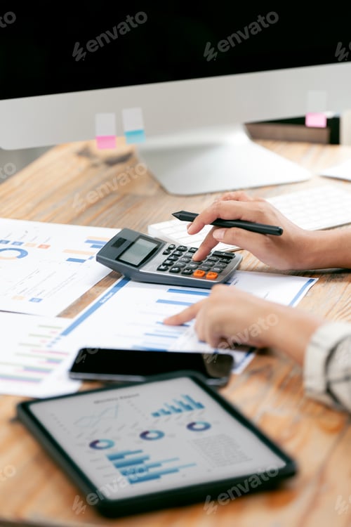 Preview: Accountant working Financial investment on calculator.
