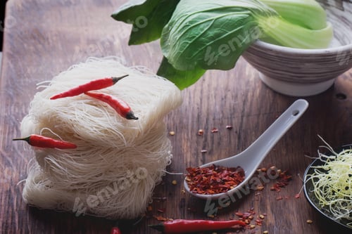 Preview: Rice Noodles and Red Chili Peppers on Wood
