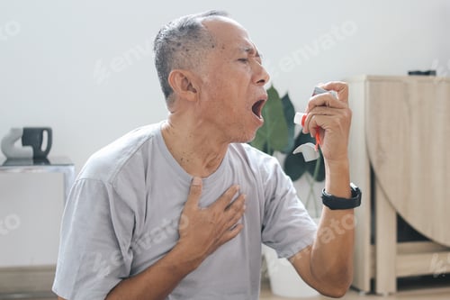 Preview: Elderly Man Using Inhaler