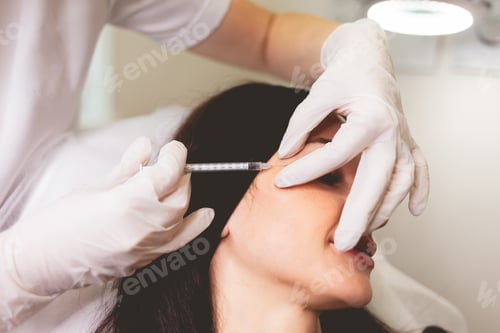 Preview: Cosmetologist makes anti-aging injections for her patient. Woman takes care of herself