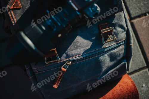 Preview: Top view of a fabric bag with acamera on top of it