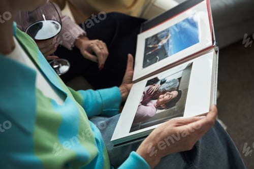 Preview: Caucasian Middle Aged Women Sharing Memories While Looking through Photo Album