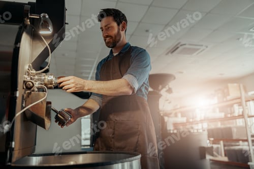 Preview: Business owner operating a modern coffee bean roasting machine