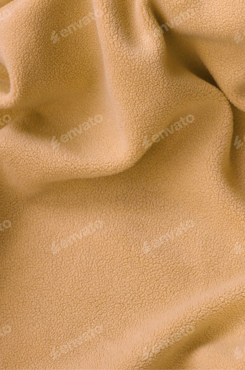 Preview: The blanket of furry orange fleece fabric. A background of light orange soft plush fleece