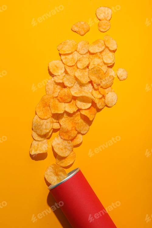 Preview: Potato chips with a red tube on a yellow background
