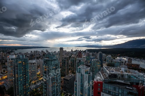 Preview: Aerial view of Downtown City during a stormy summer sunset