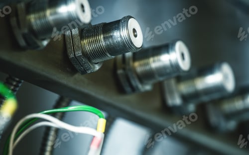 Preview: Rows of metal round plugs connected to each other