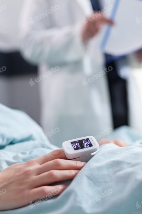Preview: Close up of hospitalized woman with finger heart rate monitor