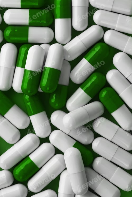 Preview: Green and white capsules close up. Medicine pills capsules background.