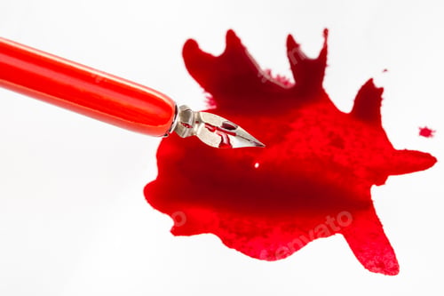 Preview: above view of nib in red dip pen over red ink blot