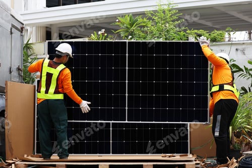 Preview: Technicians Install photovoltaic solar modules on roof of house.