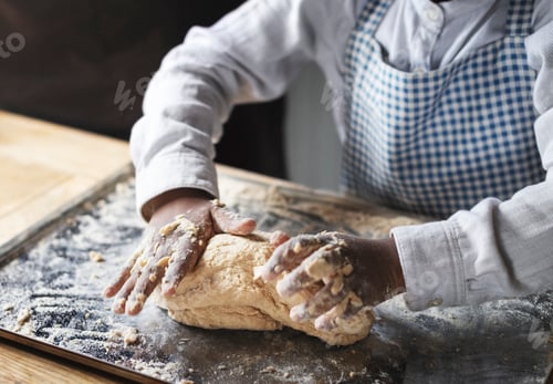 Preview: Boy kneading dough in the kitchen