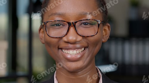 Preview: Portrait of female model smiling in front of camera