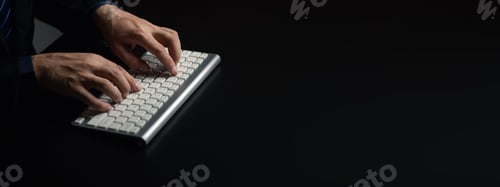 Preview: Person typing on a computer keyboard, businessman is working in a startup company's office, he is ty