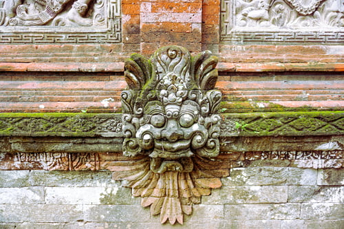 Preview: Ancient Stone Carving of a Mythical Creature on a Moss-Covered Textured Wall
