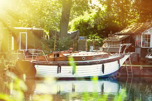 Preview: Boat on the shore of a misty river on a summer evening