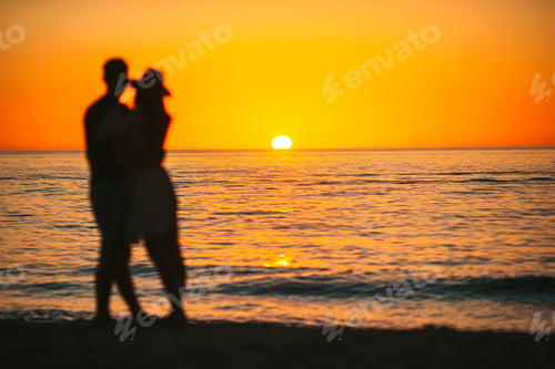 Preview: Young couple spending time together on the beach. Photo out of focus