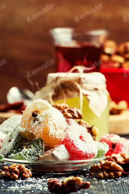 Preview: Rahat lukum, oriental sweets with honey, nuts and coconut, dark background, selective focus