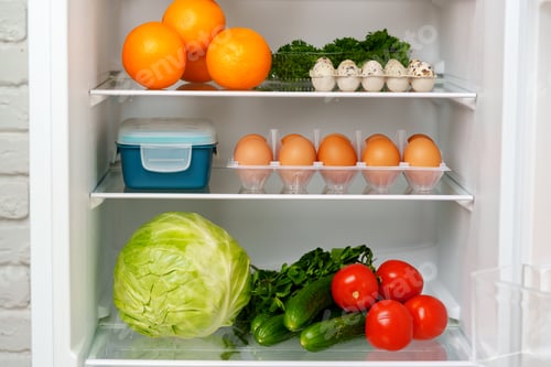 Preview: Well-Stocked Refrigerator With Fresh Produce, Eggs, and Other Groceries
