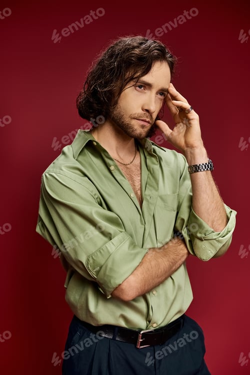 Preview: Vibrant vision: stylish man in green shirt strikes a pose