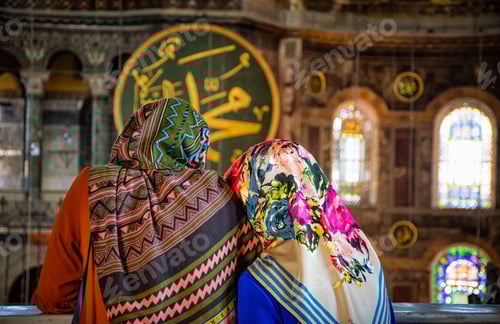 Preview: Two scarfed women in a temple