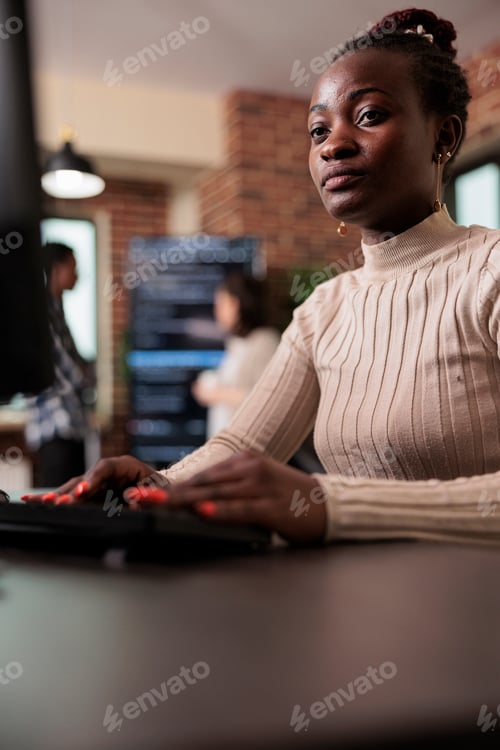 Preview: Confident african american network developer engineering application for company database