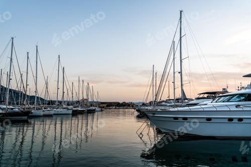 Preview: Luxury yachts moored in Marina of Mediterranean harbour at sunset