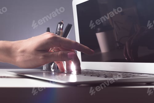 Preview: Typing on laptop closeup