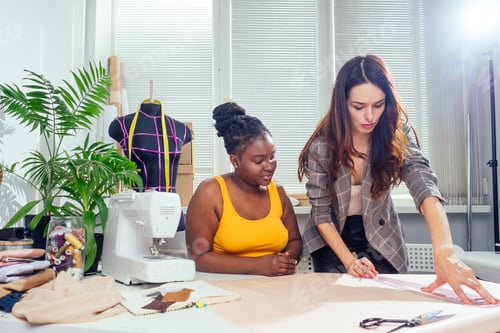 Preview: beautiful woman seamstress with long hair and afro customer.
