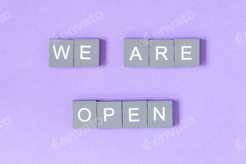 Preview: We are open quote, welcome sign for business or caffe, wooden letters on violet background
