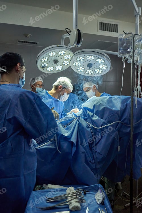 Preview: Surgery in Progress in Operating Room with Team