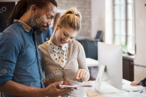Preview: Picture of young designers discussing in office