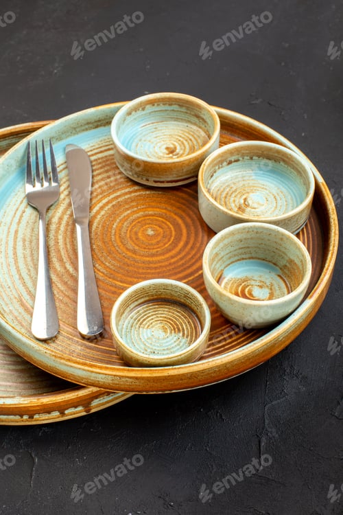 Preview: front view brown plates with fork and knife on dark background color table glass meal kitchen