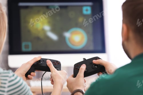 Preview: Young couple playing video game at home, closeup