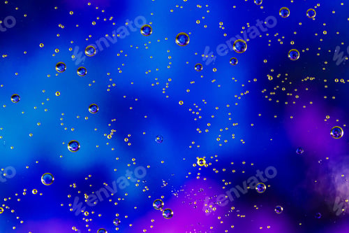 Preview: Blue background with oil circles . Bubbles of water. Close up.