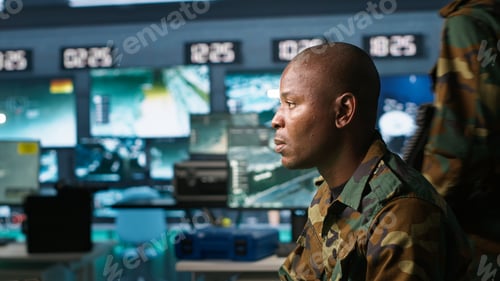 Preview: Portrait of military agent working in control room, analyzing aerial data
