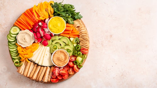 Preview: Colorful vegan Charcuterie board with raw vegetables and whole wheat snacks