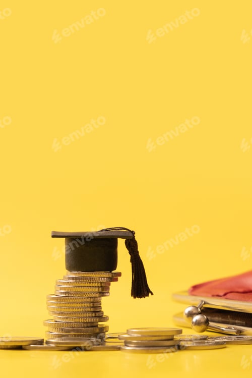 Preview: Graduated cap with coins on yellow background. Savings for education concept. Vertical photo
